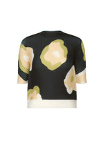 A product shot of the ISSEY MIYAKE VERVE PLEATS TOP shirt in black-hued (17).