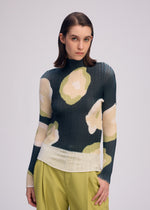 A model wears the ISSEY MIYAKE VERVE PLEATS TOP shirt.