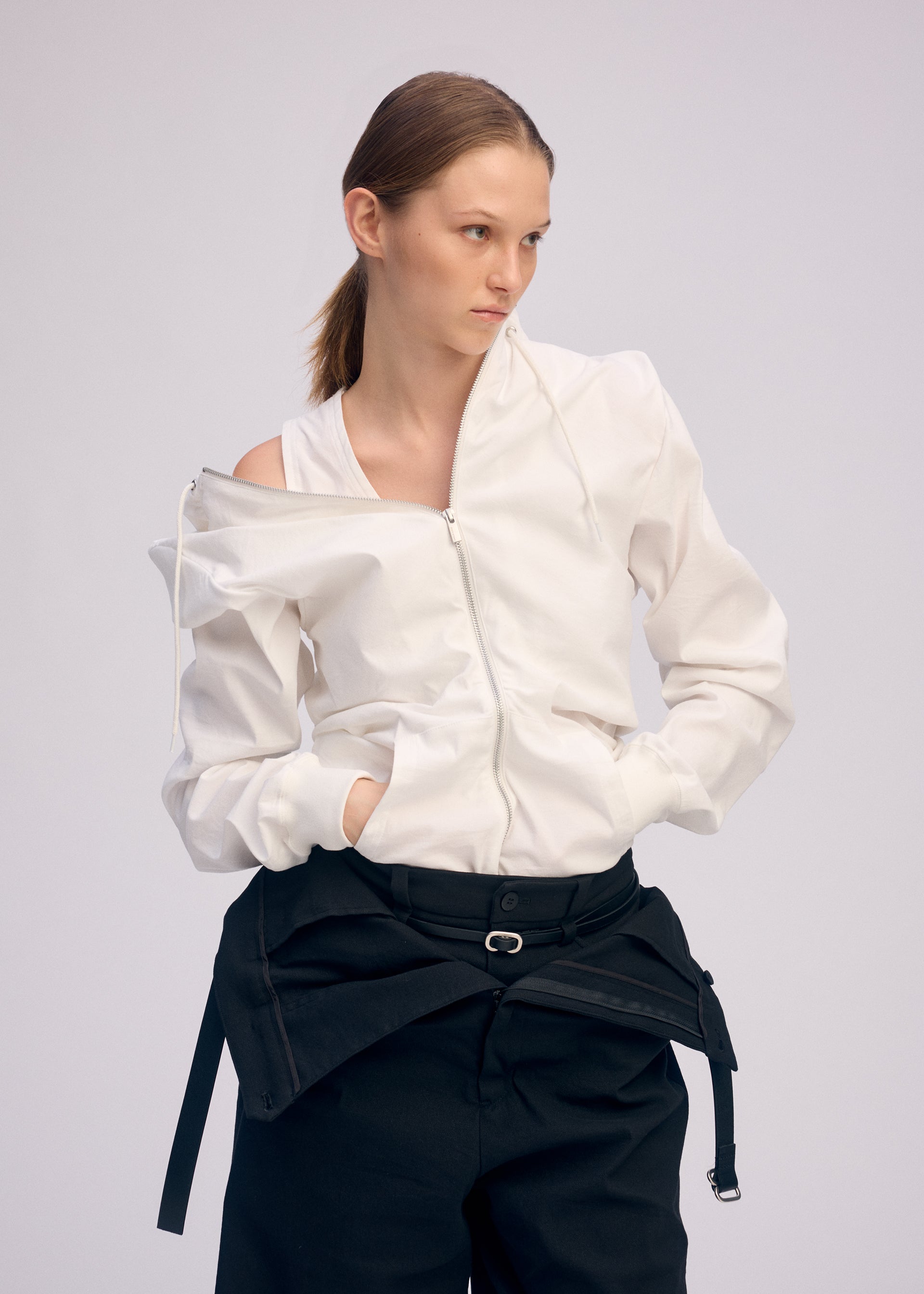A model wears the ISSEY MIYAKE GENERIC WEAR cardigan.