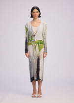 A model wears the ISSEY MIYAKE URBAN JUNGLE PLEATS cardigan.