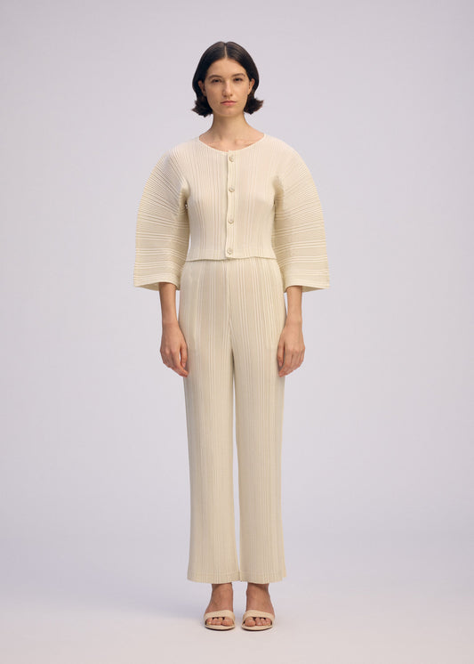 A model wears the ISSEY MIYAKE LINEN LIKE RIB PLEATS cardigan.
