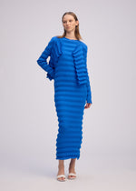 A model wears the ISSEY MIYAKE SPRING PLEATS spring-pleats-cardigan-black.