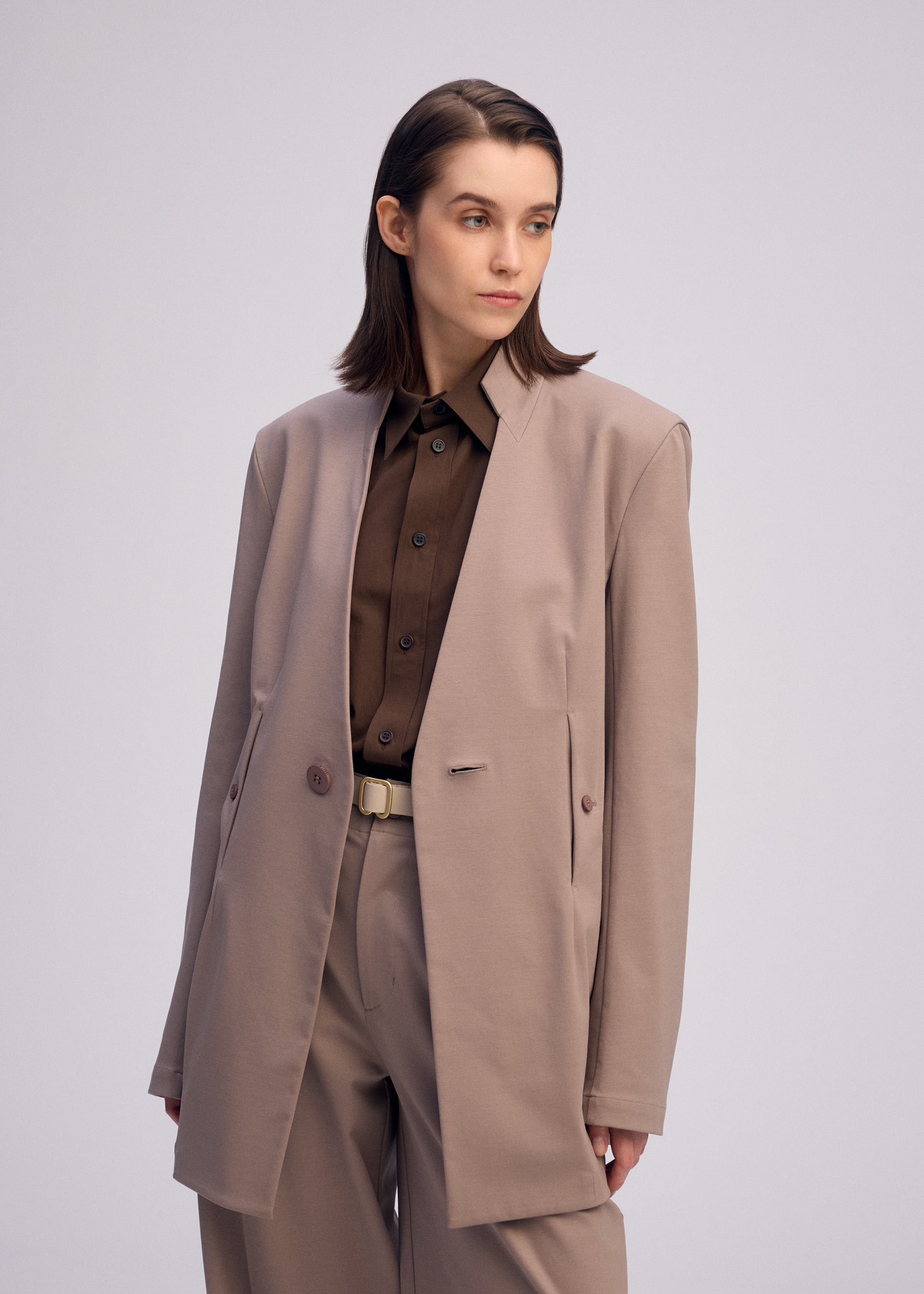 A model wears the ISSEY MIYAKE SIMPLE ENSEMBLE clothing.