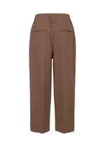 A detail shot of the ISSEY MIYAKE SIMPLE ENSEMBLE clothing.