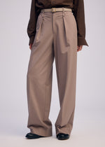 A model wears the ISSEY MIYAKE SIMPLE ENSEMBLE clothing.