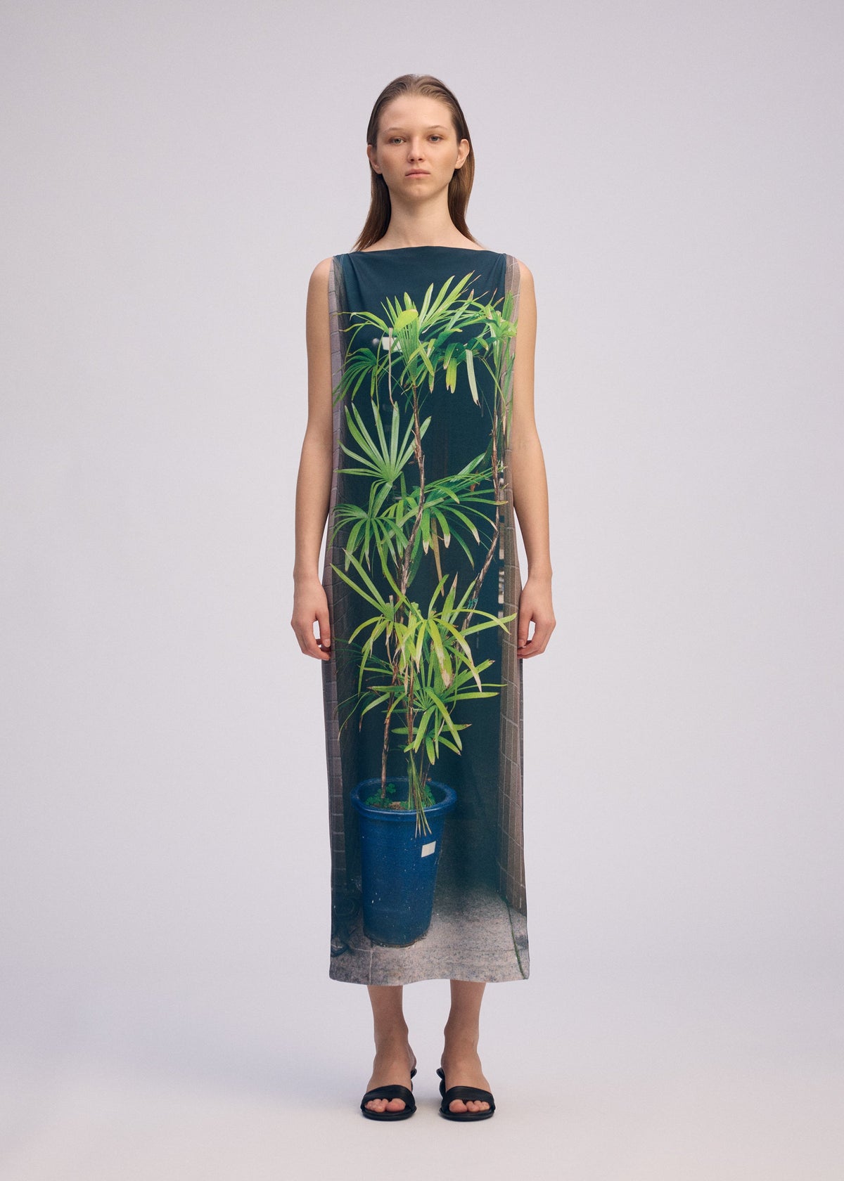 A model wears the ISSEY MIYAKE URBAN JUNGLE JERSEY dress.