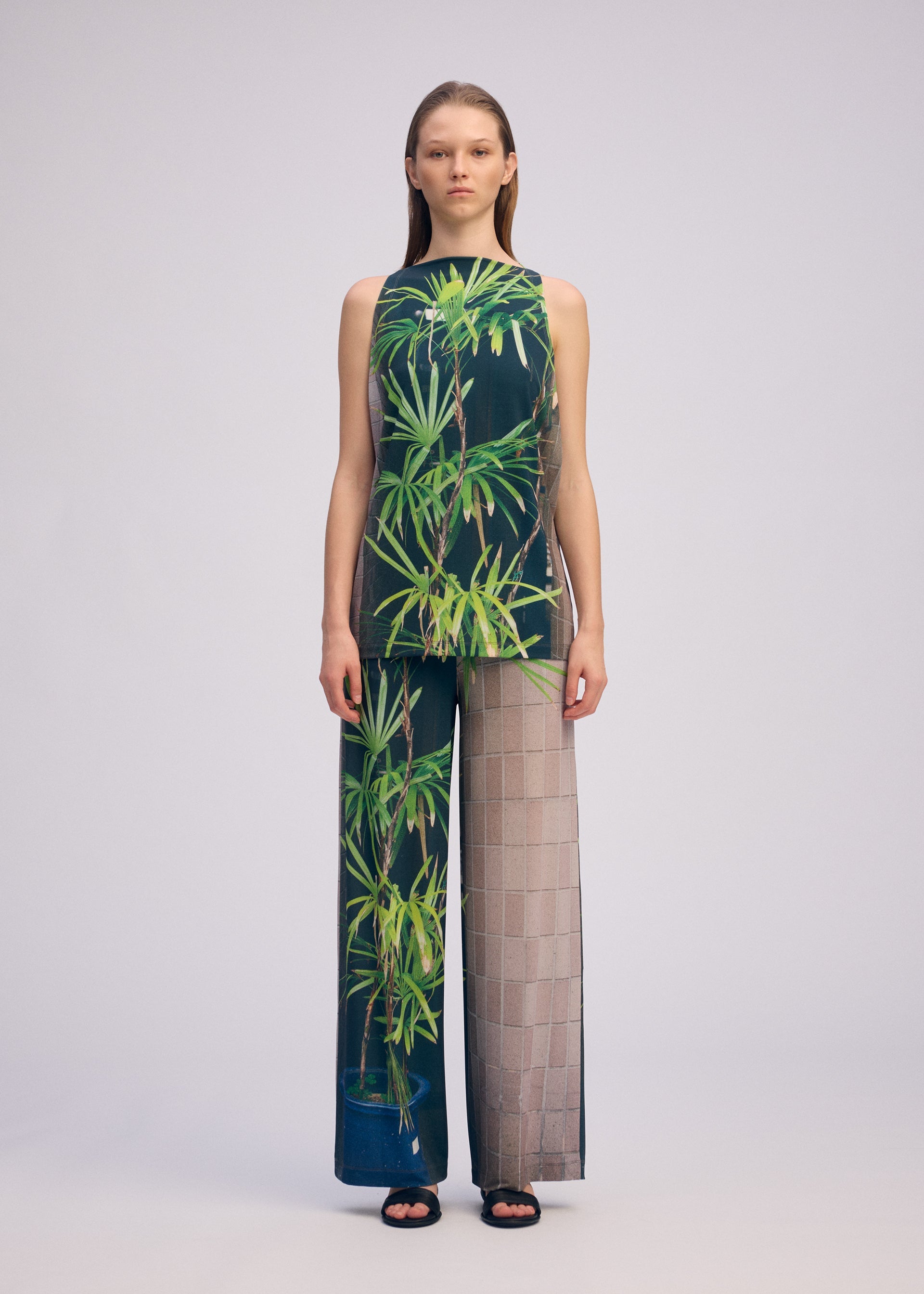 A model wears the ISSEY MIYAKE URBAN JUNGLE JERSEY shirt.