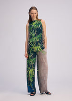 A model wears the ISSEY MIYAKE URBAN JUNGLE JERSEY shirt.