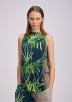 A model wears the ISSEY MIYAKE URBAN JUNGLE JERSEY shirt.