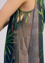 A model wears the ISSEY MIYAKE URBAN JUNGLE JERSEY shirt.