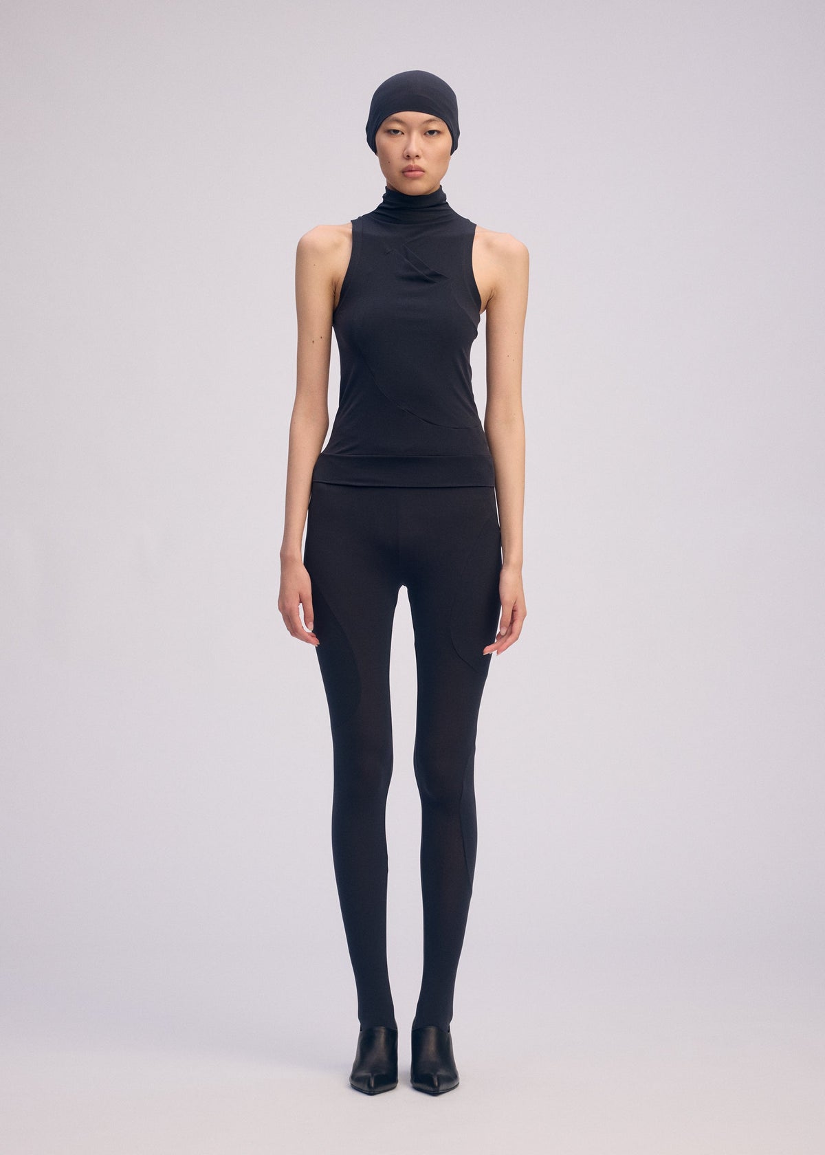 A model wears the ISSEY MIYAKE A SHOPPER'S BODY clothing.