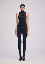 A model wears the ISSEY MIYAKE A SHOPPER'S BODY clothing.