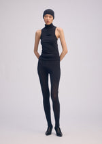 A model wears the ISSEY MIYAKE A SHOPPER'S BODY clothing.