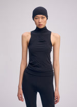 A model wears the ISSEY MIYAKE A SHOPPER'S BODY clothing.