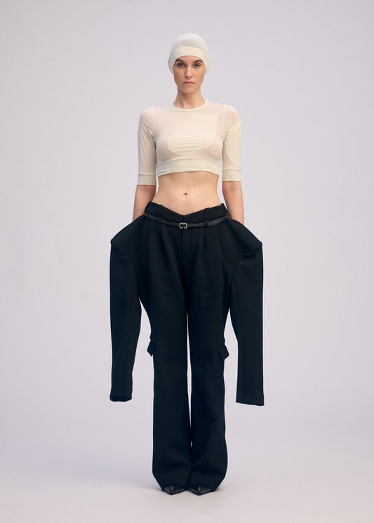 A model wears the ISSEY MIYAKE A SHOPPER'S BODY clothing.