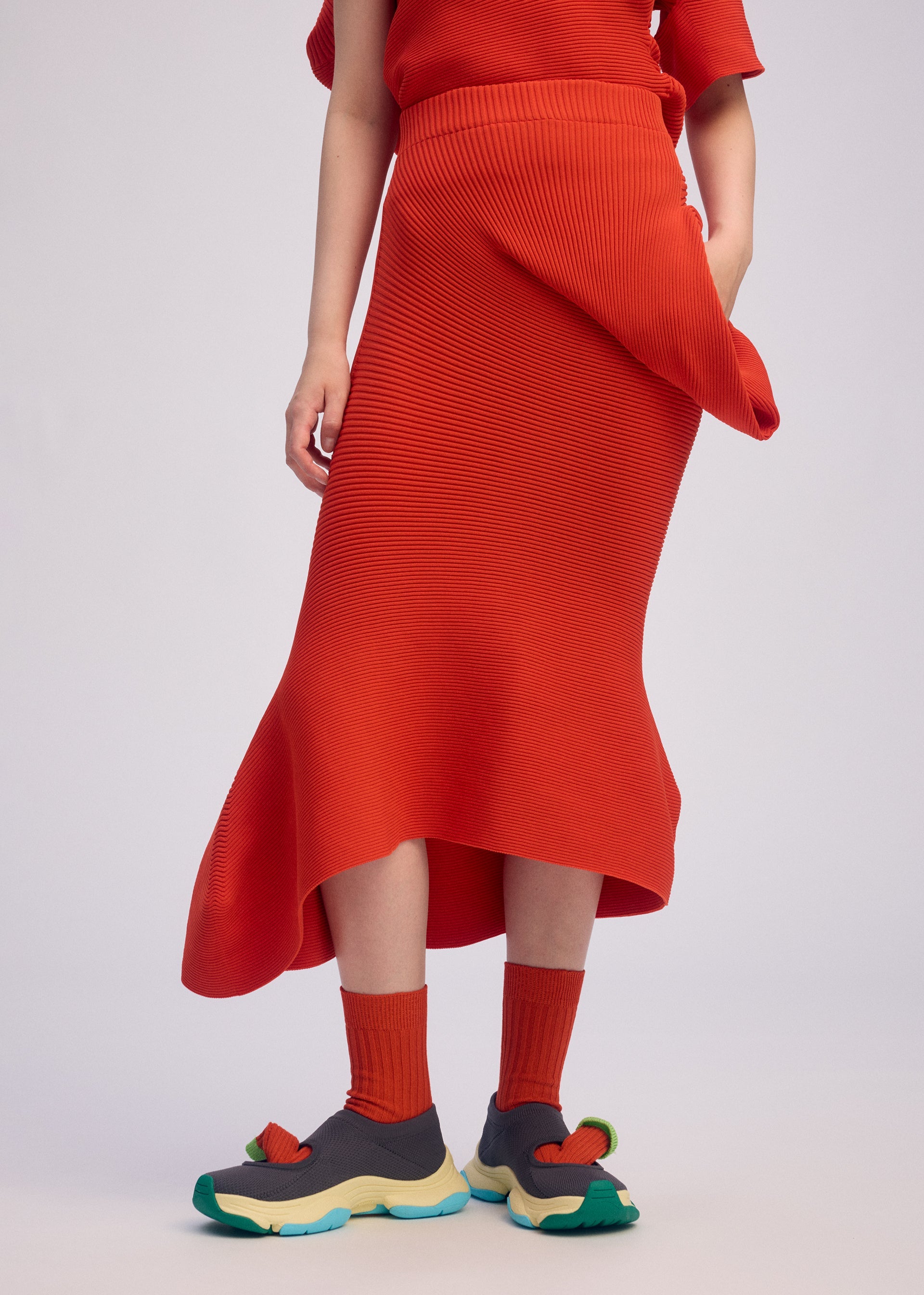 A model wears the ISSEY MIYAKE LIFE FORM skirt.