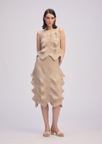 A model wears the ISSEY MIYAKE LINKAGE skirt.