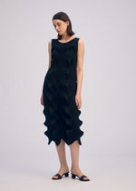 A model wears the ISSEY MIYAKE LINKAGE dress.