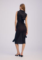 A model wears the ISSEY MIYAKE ADVENTITIOUS HIGH NECKS dress.