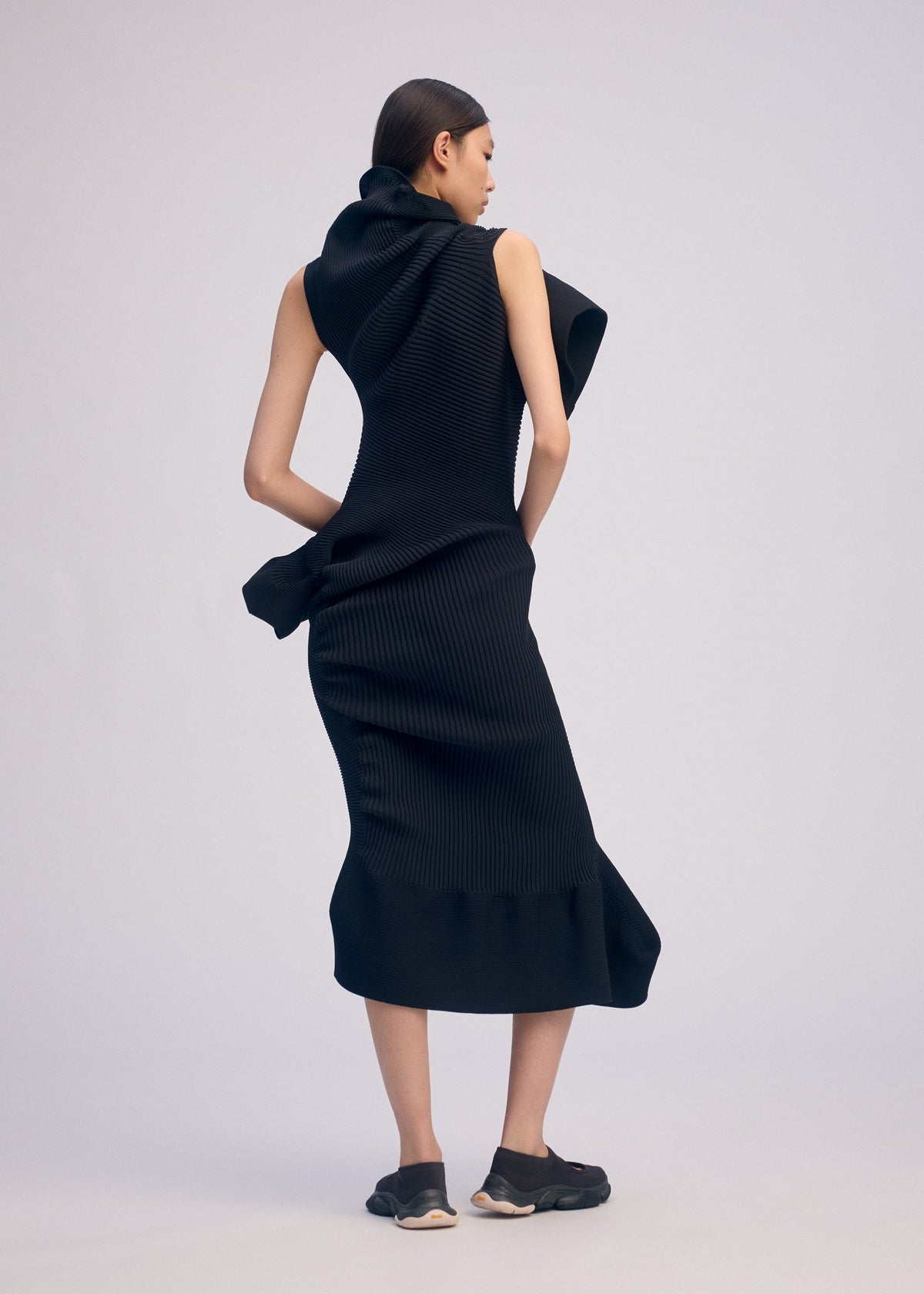 A model wears the ISSEY MIYAKE LIFE FORM dress.