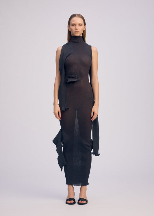 A model wears the ISSEY MIYAKE ADVENTITIOUS SLEEVES dress.