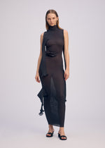 A model wears the ISSEY MIYAKE ADVENTITIOUS SLEEVES dress.