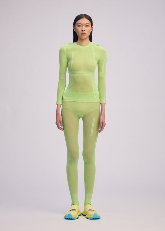 A model wears the ISSEY MIYAKE SLITS MESH AP top.