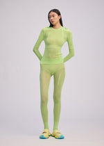 A model wears the ISSEY MIYAKE SLITS MESH AP top.