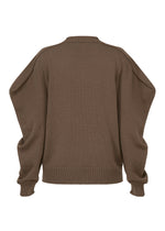 A detail shot of the ISSEY MIYAKE AKIMBO KNIT clothing.