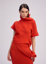 A model wears the ISSEY MIYAKE LIFE FORM top.