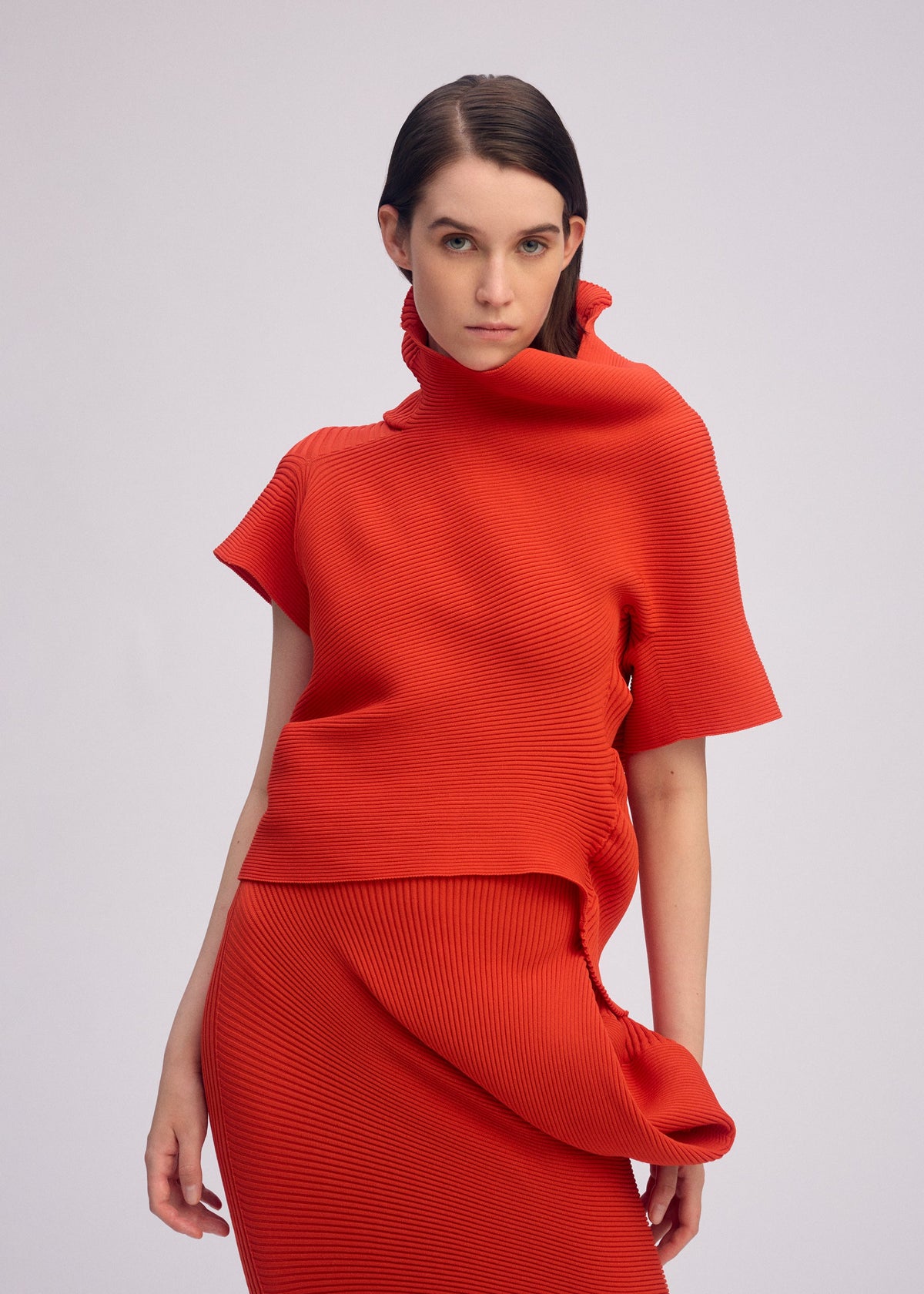 A model wears the ISSEY MIYAKE LIFE FORM top.