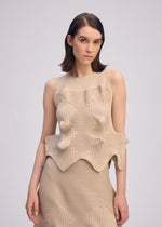 A model wears the ISSEY MIYAKE LINKAGE top.