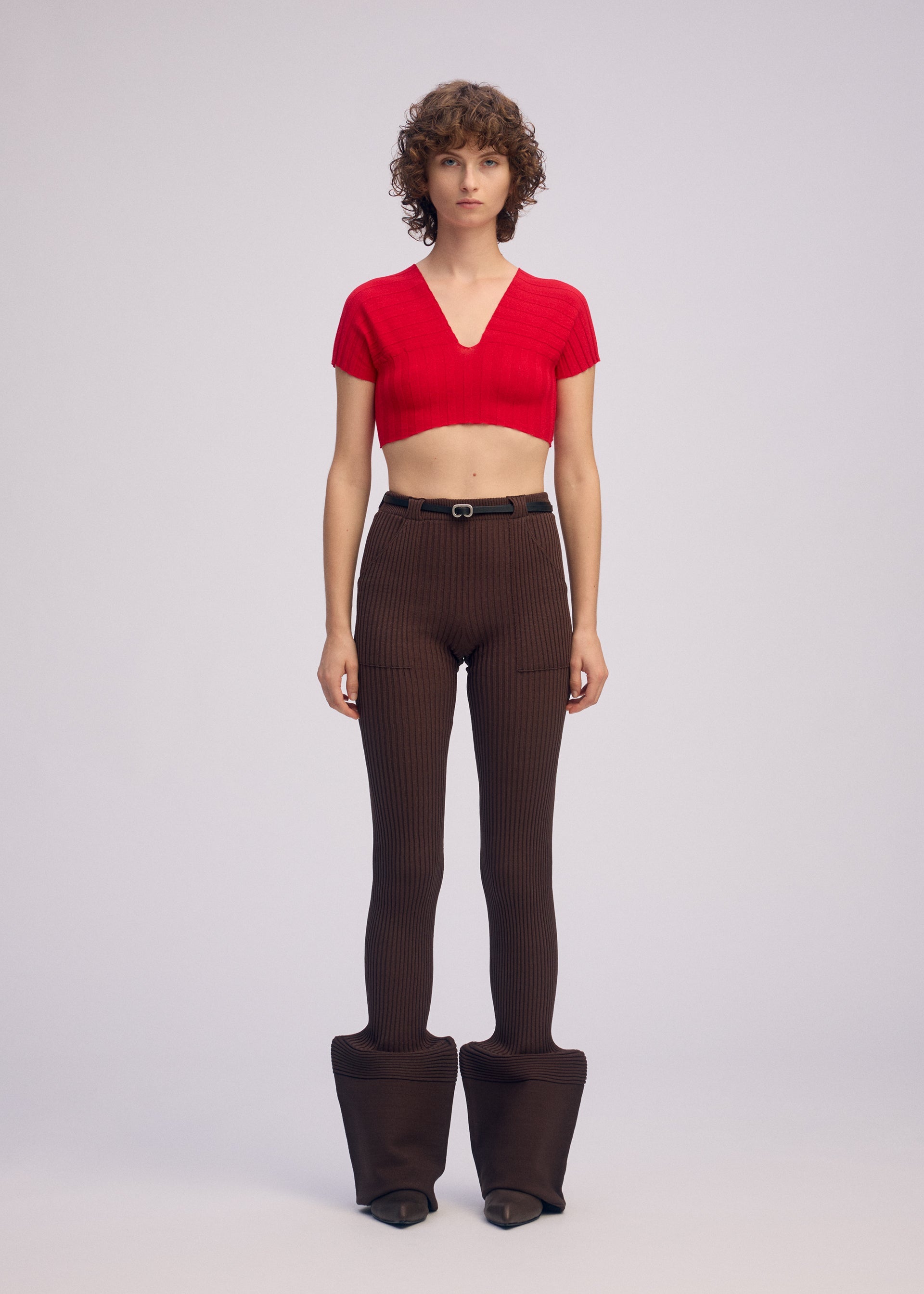 A model wears the ISSEY MIYAKE ELEPHANT KNIT clothing.