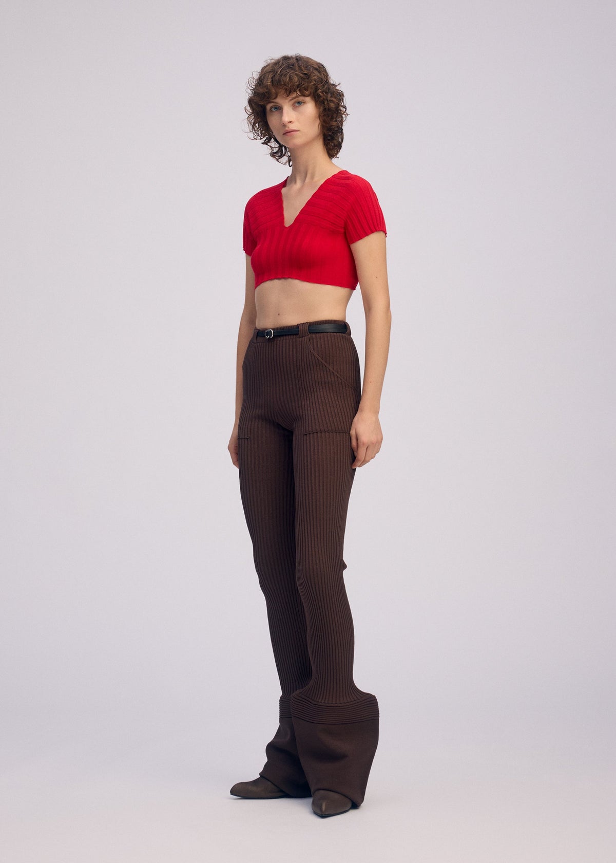 A model wears the ISSEY MIYAKE ELEPHANT KNIT clothing.