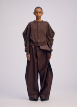 A model wears the ISSEY MIYAKE AKIMBO KNIT clothing.