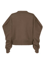 A detail shot of the ISSEY MIYAKE AKIMBO KNIT clothing.