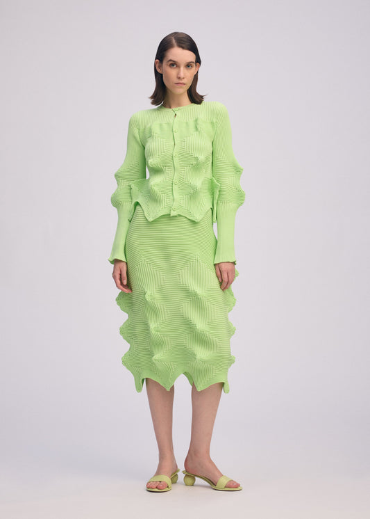 A model wears the ISSEY MIYAKE LINKAGE cardigan.