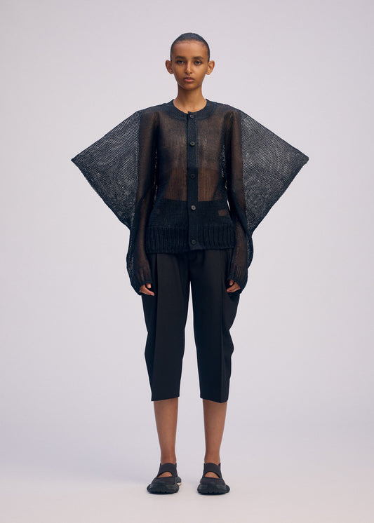 A model wears the ISSEY MIYAKE CIALDA cardigan.