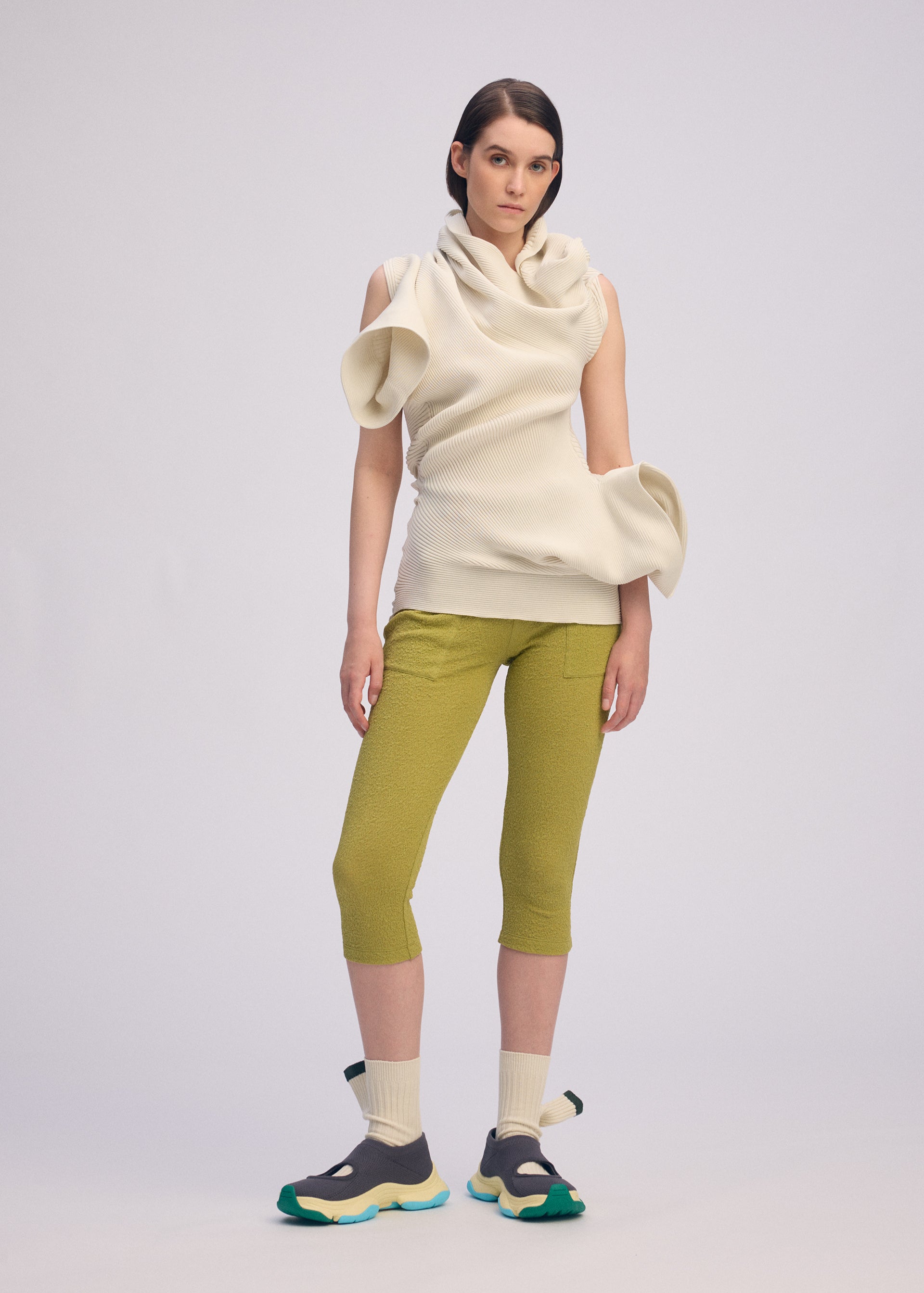 A model wears the ISSEY MIYAKE LIFE FORM dress.