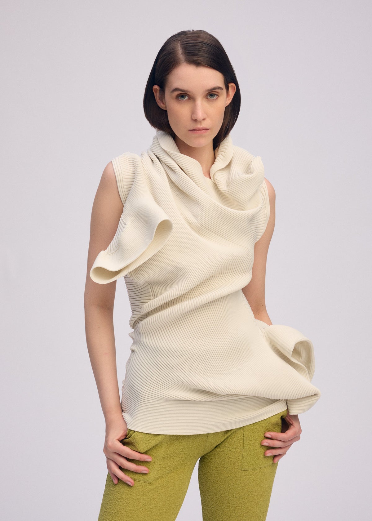 A model wears the ISSEY MIYAKE LIFE FORM dress.