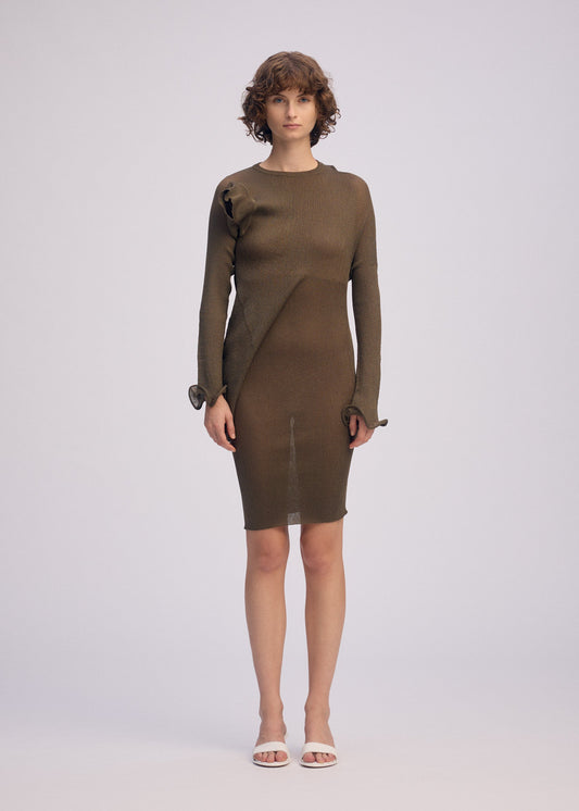 A model wears the ISSEY MIYAKE ADVENTITIOUS SLEEVES dress.