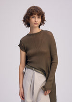 A model wears the ISSEY MIYAKE ADVENTITIOUS SLEEVES dress.