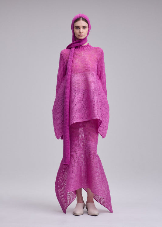 A model wears the ISSEY MIYAKE PANINI BALACLAVA panini-balaclava-cap-black.