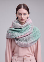 A model wears the ISSEY MIYAKE BUMPY WOOL STOLE bumpy-wool-stole-stole-black-hued.