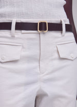 A model wears the ISSEY MIYAKE SOLID LEATHER BELT solid-leather-belt-belt-black-3.