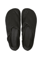A detail shot of the ISSEY MIYAKE PEU FORM shoes.