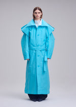 A model wears the ISSEY MIYAKE CORRELATION correlation-coat-dark-navy.