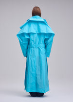 A model wears the ISSEY MIYAKE CORRELATION correlation-coat-dark-navy.