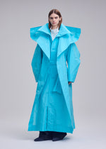A model wears the ISSEY MIYAKE CORRELATION correlation-coat-dark-navy.