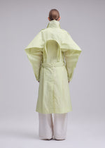 A model wears the ISSEY MIYAKE CORRELATION correlation-dynamic-silhouette-coat-dark-navy.